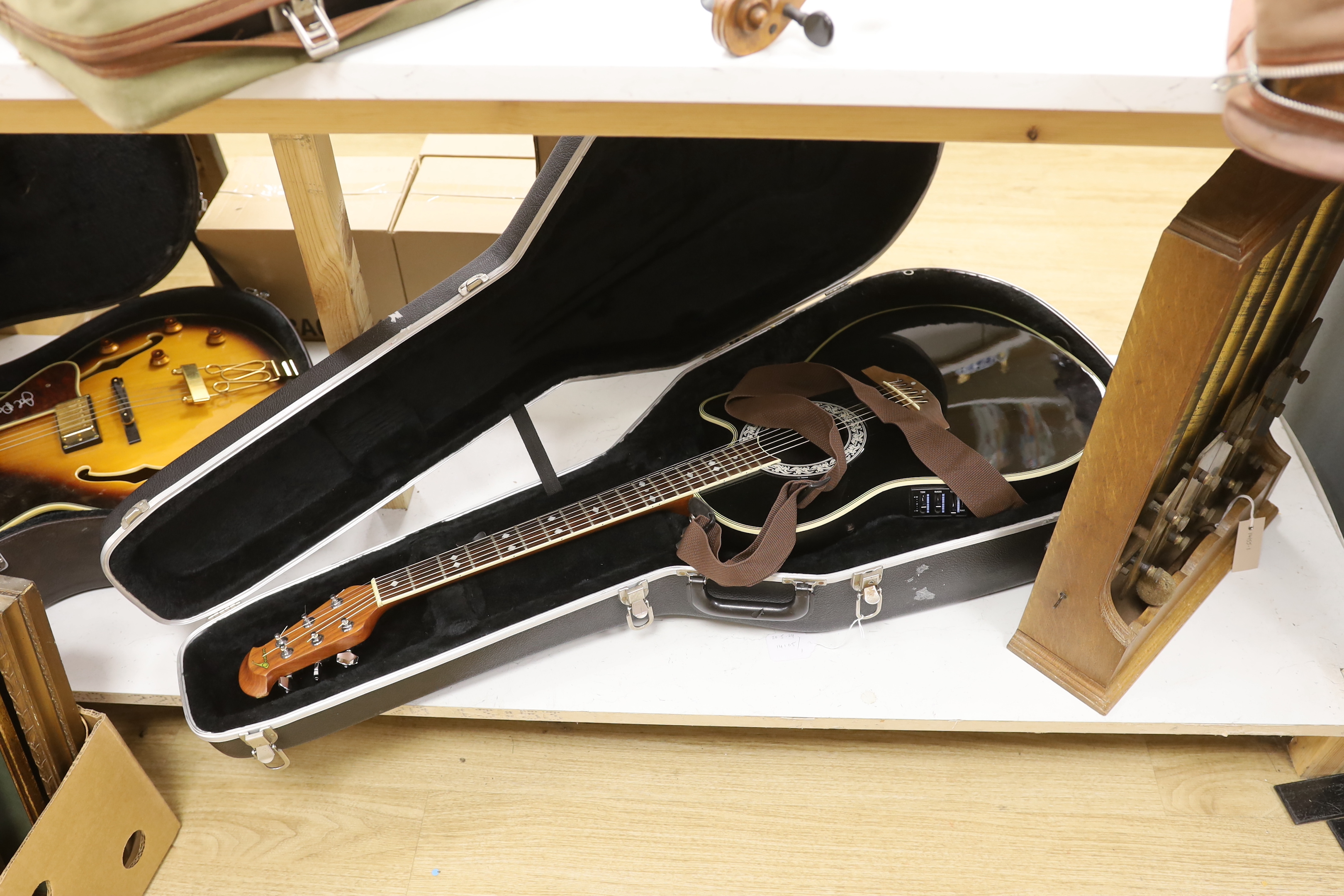 A Celebrity by Ovation electro-acoustic round back guitar with hard case
